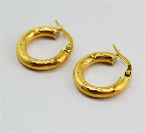 aretes lv de oro|aretes de oro mujer.